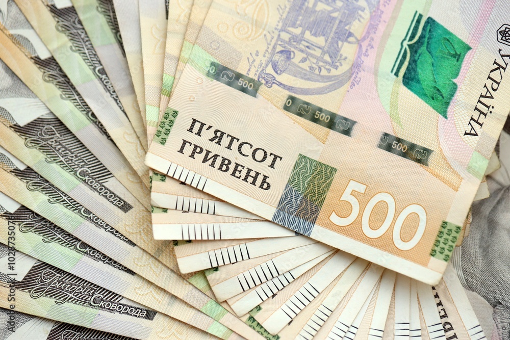Big amount of different ukrainian hryvnia currency money bills in pile Big amount of different ukrainian hryvnia currency money bills in pile