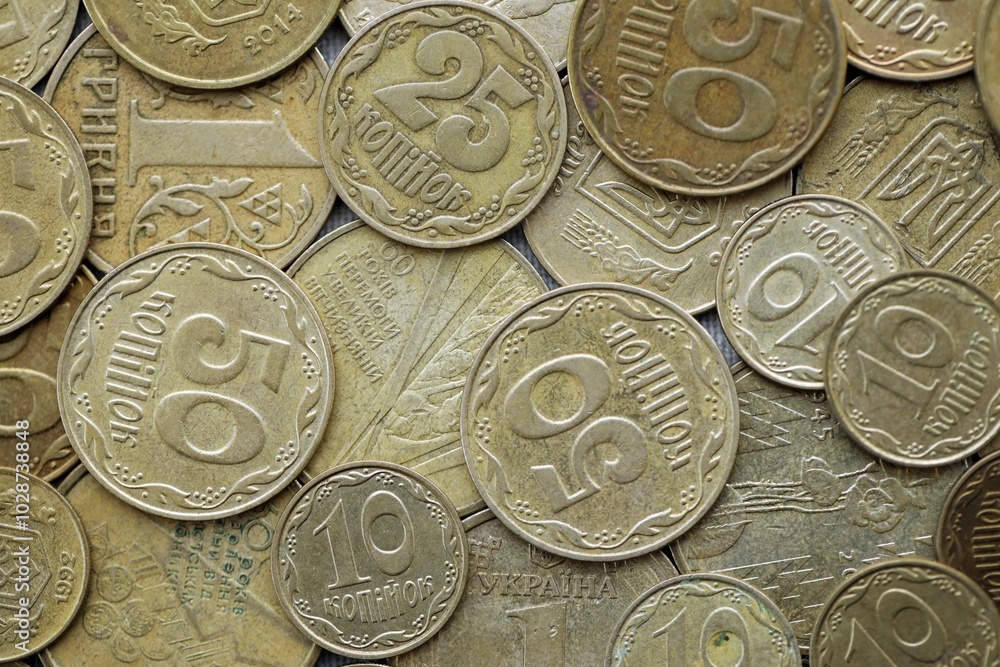 Big pile of different coins from various time period in Ukraine. Shiny Ukrainian money background Big pile of different coins from various time period in Ukraine. Shiny Ukrainian money background