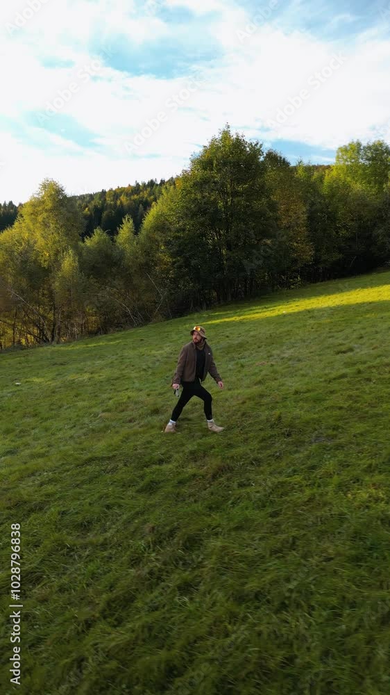 walking in the grass, walking in the mountains, a traveler walks through a green field in the mountains at dawn, Aerial footage of a drone walking in the grass, walking in the mountains, a traveler walks through a green field in the mountains at dawn, Aerial footage of a drone