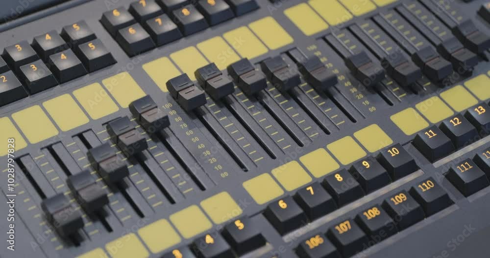 Sound engineer's console working, music studio equipment. Real time close up handheld interior shot, artificial lighting. Looping 4K video clip. Sound engineer's console working, music studio equipment. Real time close up handheld interior shot, artificial lighting. Looping 4K video clip.