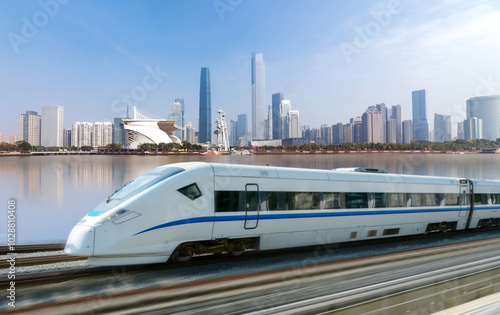 High-speed rail speeds on Bridges and the modern city skyline of guangzhou, China