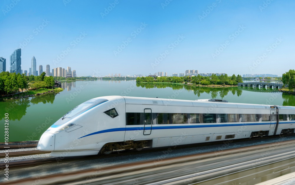 High-speed rail speeds on Bridges and the modern city skyline of shaoxing, zhejiang,China