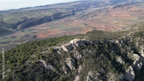 Amazing aerial 360º view of an hermitage on top of a mountain photo