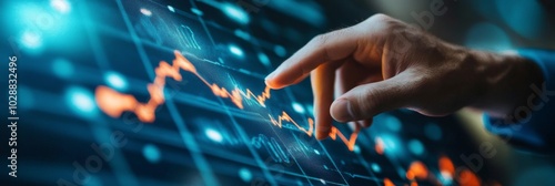 A person analyzing financial data on a digital screen at an office during the...