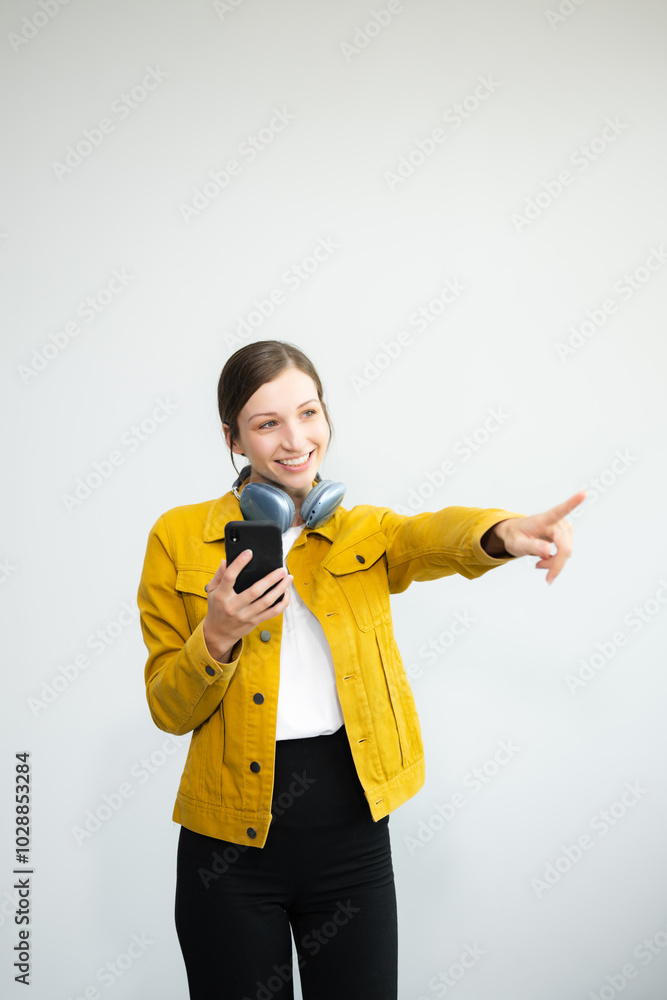 Young Caucasian woman 20s wears casual clothes stand on toes dance lean back have fun spreading hands isolated on plain light white background Young Caucasian woman 20s wears casual clothes stand on toes dance lean back have fun spreading hands isolated on plain light white background