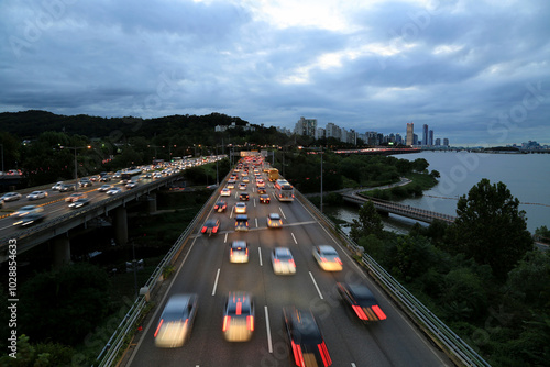 Dongjak-gu, Seoul, Korea - September 11, 2019: Night view of cars on the Olympic Boulevard with the background of Han River  photo