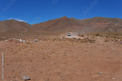 mountain scenery with a car driving along the road to Iruya, Salta. photo