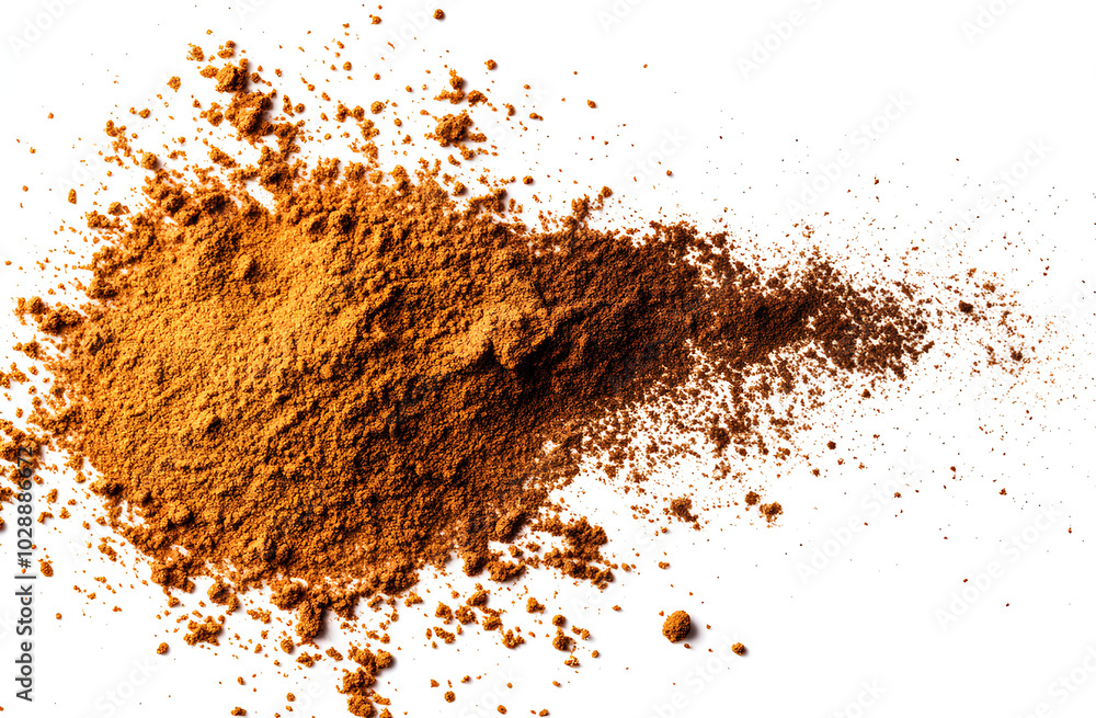A close-up image of brown powder, likely cinnamon, spilled on a white surface. A close-up image of brown powder, likely cinnamon, spilled on a white surface.