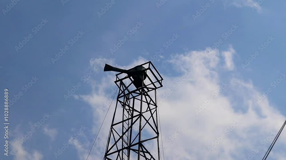 The old air raid siren on the krusty tower, emergency alarm, vintage military The old air raid siren on the krusty tower, emergency alarm, vintage military