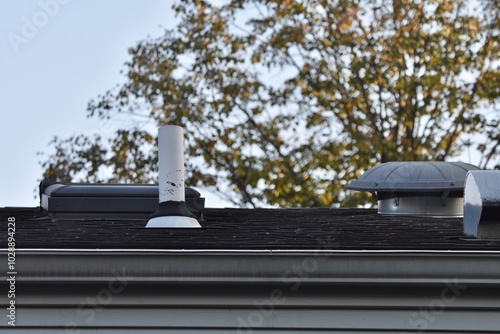 exhaust vents and vent stack on house roof