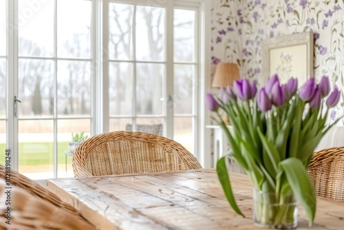 Bright and Airy Dining Room with Large Windows, Rustic Interior, Floral Wallpaper, and Soft Tulips on a Wooden Table photo