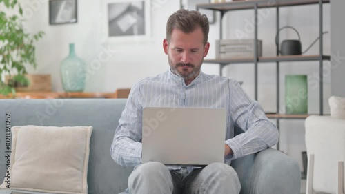 Wallpaper Mural Pensive Middle Aged Man Working on Laptop in Lap Torontodigital.ca