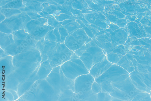 The light reflects blue in the water in the swimming pool. It looks fresh and lively, suitable for use as a wallpaper.