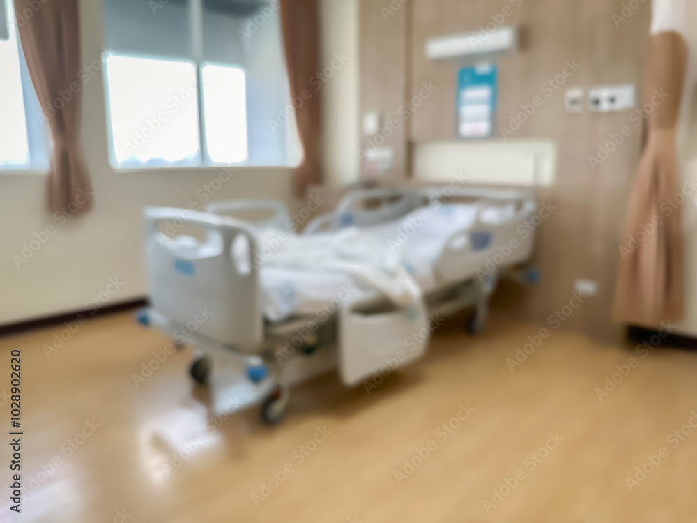 Blur image of Hospital bed in a luxurious and modern patient room. The atmosphere is clear and you can see the surrounding view Blur image of Hospital bed in a luxurious and modern patient room. The atmosphere is clear and you can see the surrounding view