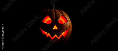 glowing carved pumpkin with a toothy grin