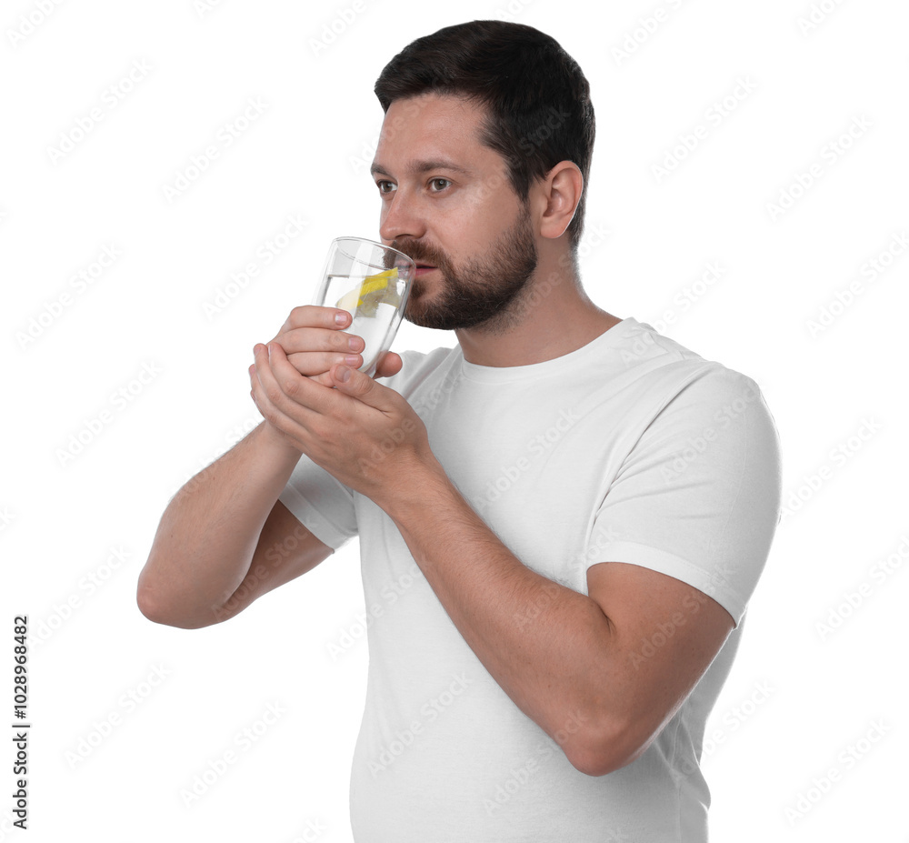 Handsome man drinking water with lemon on white background Handsome man drinking water with lemon on white background