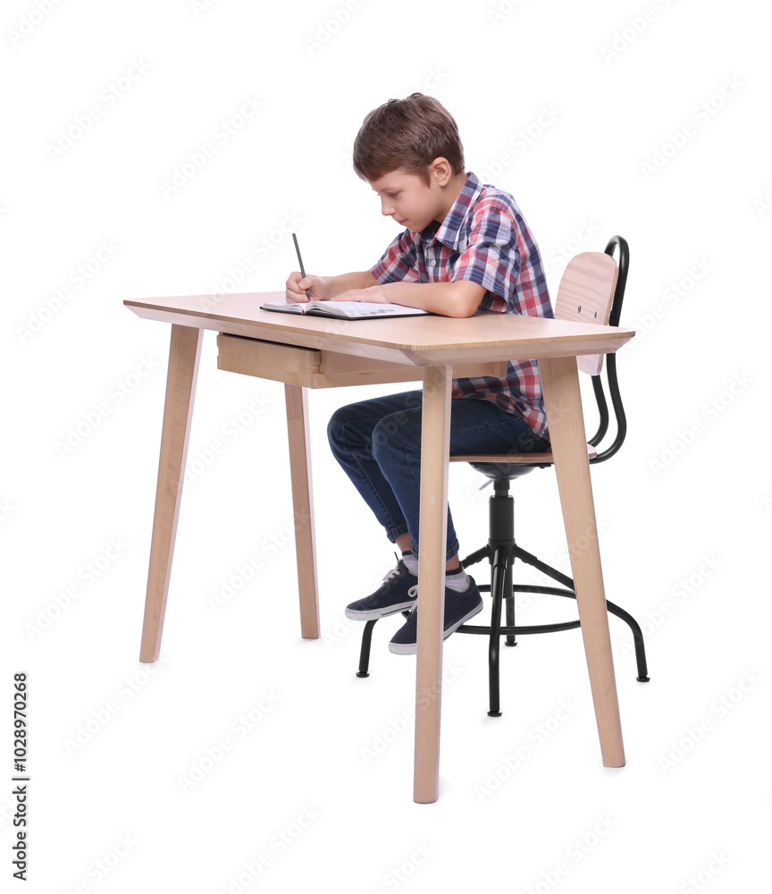 Boy with incorrect posture and notebook at wooden desk on white background Boy with incorrect posture and notebook at wooden desk on white background