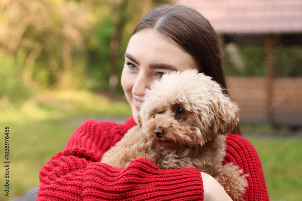 Woman with cute dog in autumn park Woman with cute dog in autumn park