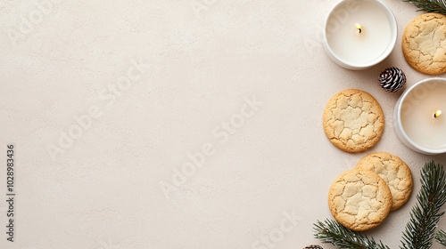 Cozy holiday cookies with candles on a soft beige background.