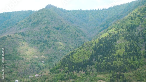 Mountain landscape. Small village at the foot of the mountains