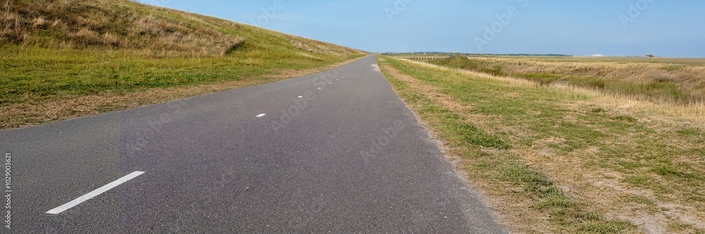 Obraz premium panorama view road in the dunes