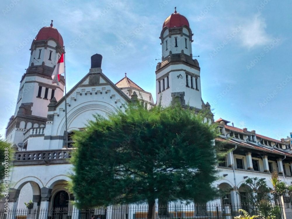 The beauty of the Lawang Sewu building in the morning with a blue sky background. Lawang Sewu. An iconic building in the city of Semarang. Indonesia. The beauty of the Lawang Sewu building in the morning with a blue sky background. Lawang Sewu. An iconic building in the city of Semarang. Indonesia.