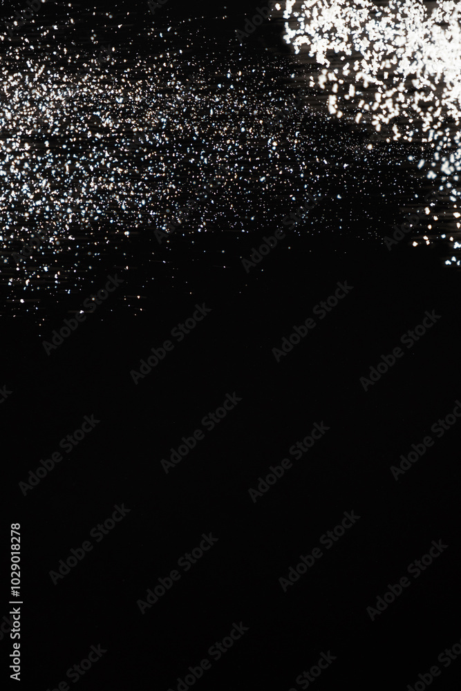 Abstract black and white background of pouring flour, space for text Abstract black and white background of pouring flour, space for text