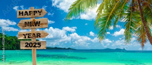 2025 happy new year writting on a wooden sign on the tropical beach