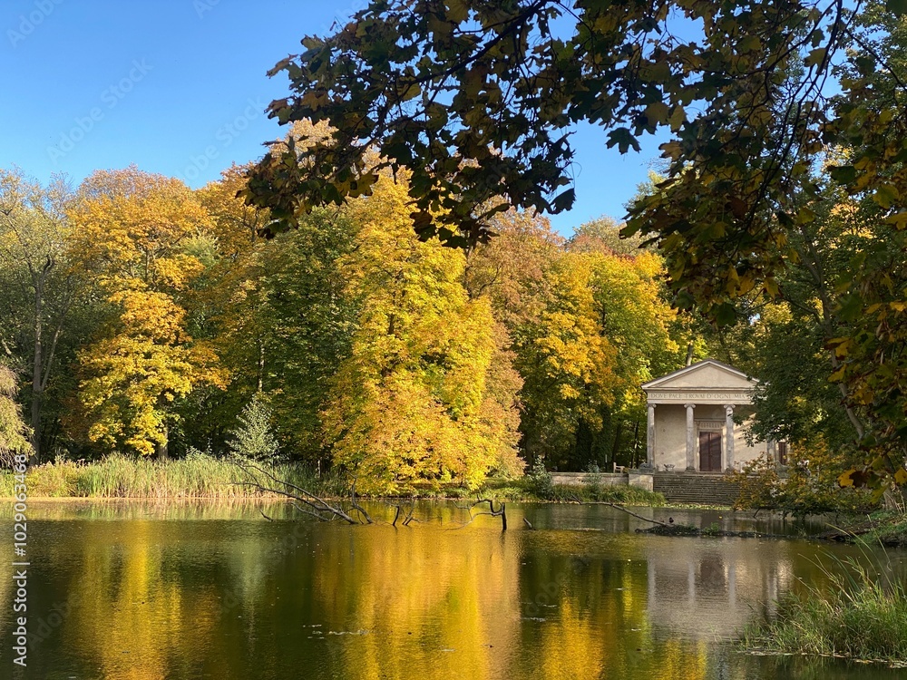 Tranquil Autumn Scene with Lakeside Temple and Vibrant Fall Foliage Tranquil Autumn Scene with Lakeside Temple and Vibrant Fall Foliage