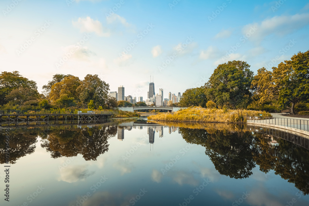 the reflected lincoln park and skyline of chicago