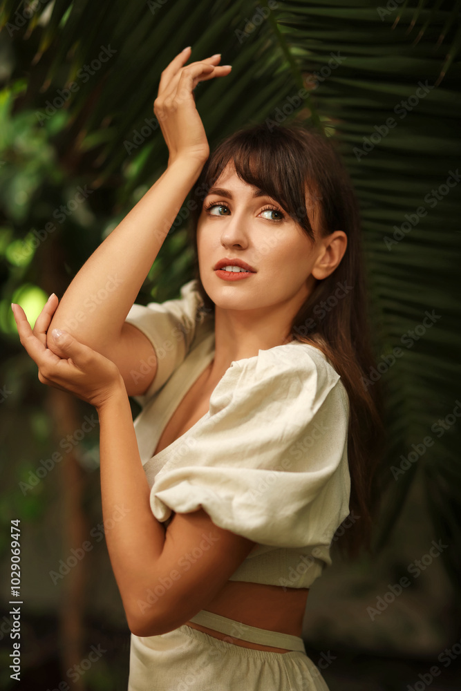 Portrait of beautiful woman posing in tropical forest Portrait of beautiful woman posing in tropical forest