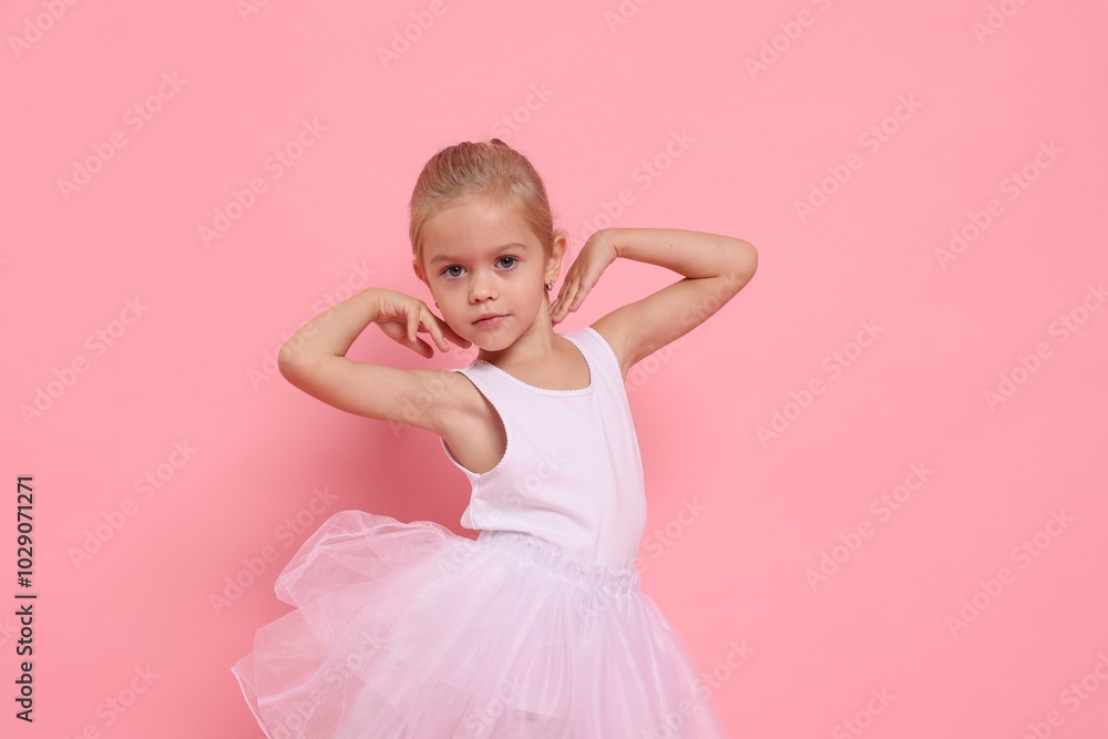 Little girl pretending to be ballerina on pink background. Dreaming of future profession Little girl pretending to be ballerina on pink background. Dreaming of future profession