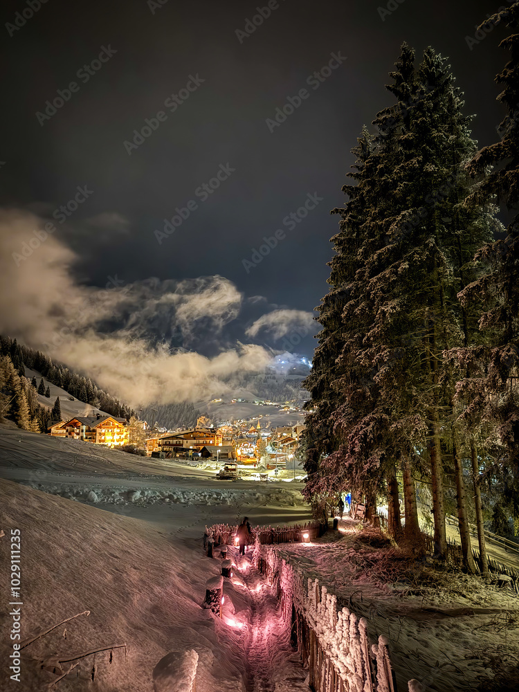 Scenic view of illuminated Wolkenstein in Gröden Selva in Val Gardena covered with snow at night