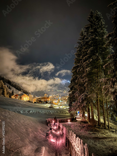 Scenic view of illuminated Wolkenstein in Gröden Selva in Val Gardena covered with snow at night