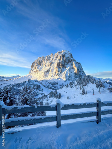 Obraz na płótnie Langkofel mountain in South Tyrol, Italy covered with snow at sunrise against blue sky w salonie