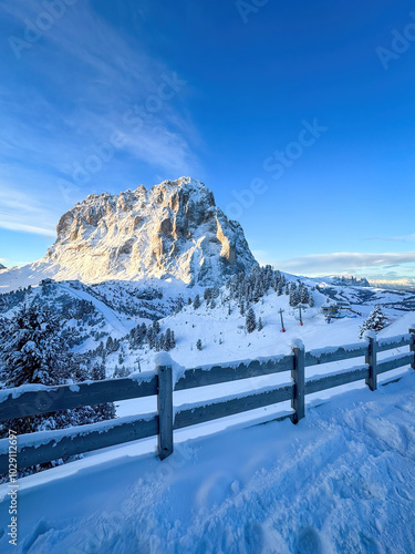 Obraz na płótnie Langkofel mountain and Schlern in South Tyrol, Italy covered with snow at sunrise against blue sky with clouds w salonie