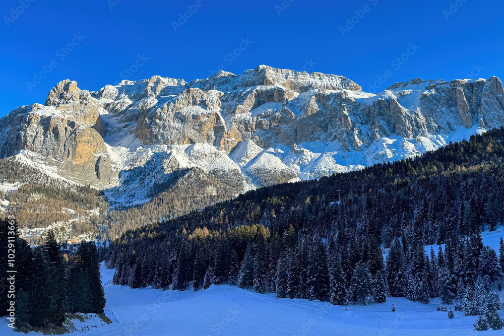 Scenic view of Sella group mountain massif in South Tyrol, Italy covered with snow against blue sky