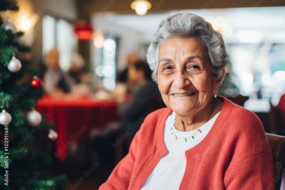 Portrait of a smiling Hispanic senior woman in nursing home during Christmas Portrait of a smiling Hispanic senior woman in nursing home during Christmas