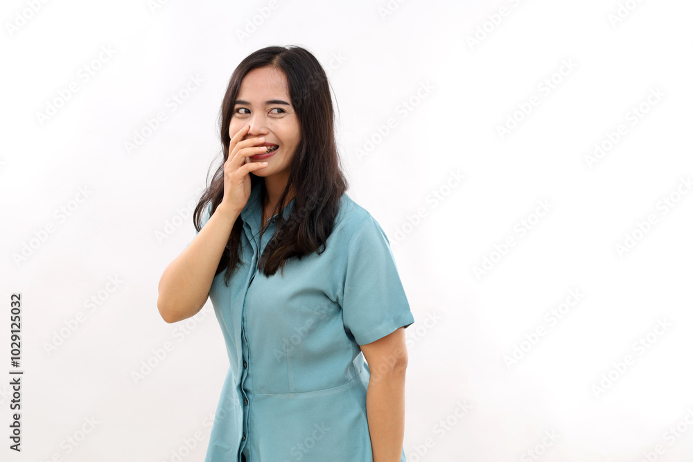 Cheerful Asian female gazes aside daydreams and remembers lovely moment smiles expresses positive candid emotions isolated white background. Youth lifestyle Cheerful Asian female gazes aside daydreams and remembers lovely moment smiles expresses positive candid emotions isolated white background. Youth lifestyle
