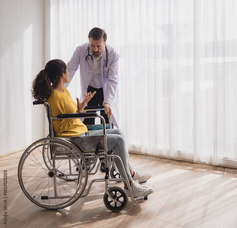 Health care latin woman sick sit wheelchair with man doctor caucasian two people check and treat patients talk help support explain medicine sick person in take care your health hospital clinic room. Health care latin woman sick sit wheelchair with man doctor caucasian two people check and treat patients talk help support explain medicine sick person in take care your health hospital clinic room.