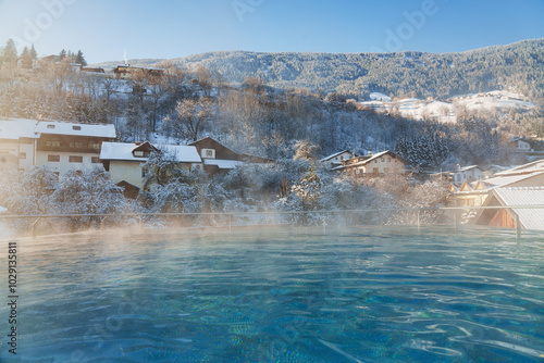  Swimming pool in winter season. Winter resort for winter holiday - vacation.