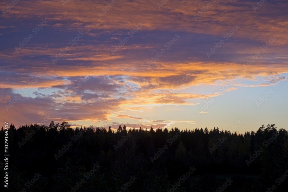 Magical sunset in winter in January over Bredebolet in Skaraborg in Vaestra Goetaland in Sweden on a cold day Magical sunset in winter in January over Bredebolet in Skaraborg in Vaestra Goetaland in Sweden on a cold day