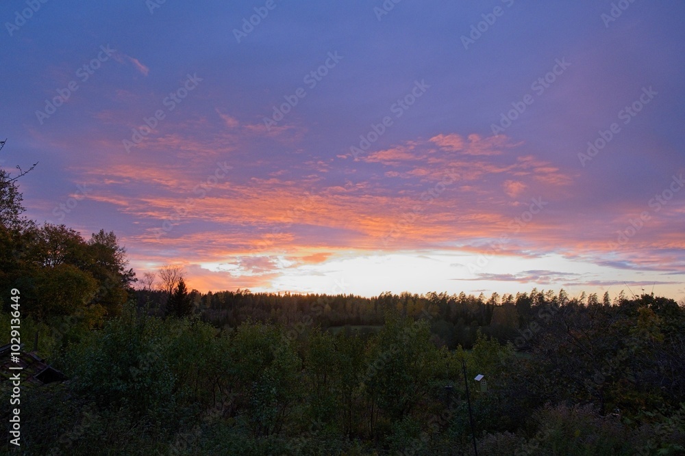 Magical sunset in winter in January over Bredebolet in Skaraborg in Vaestra Goetaland in Sweden on a cold day Magical sunset in winter in January over Bredebolet in Skaraborg in Vaestra Goetaland in Sweden on a cold day