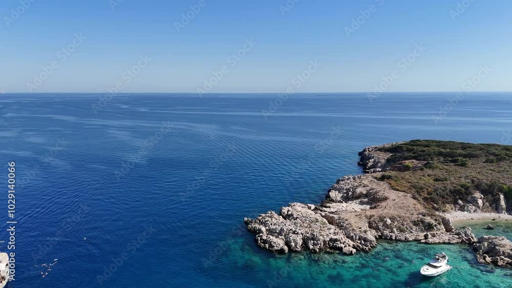 Drone View of Yachts Moored Near Island with Tourists Swimming on a Sunny Day Drone View of Yachts Moored Near Island with Tourists Swimming on a Sunny Day