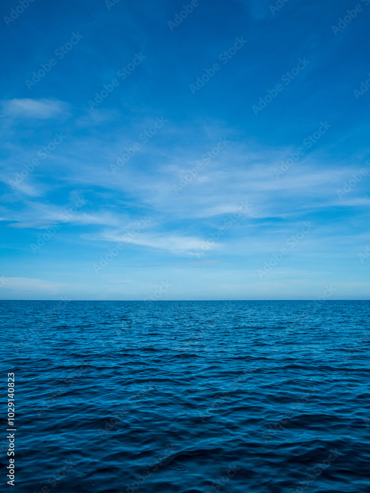 Fototapeta premium Horizon beautiful landscape summer season vertical front view point tropical sea beach white sand clean blue sky background calm nature ocean wave water travel at mook island sun day time