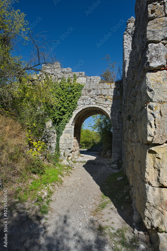Russia, the Republic of Crimea. View of the fragments of the dilapidated stone fortress of the famous Pyatigorsk city of Mangup-Kale of the 5th century in the Bakhchisarai district. Russia, the Republic of Crimea. View of the fragments of the dilapidated stone fortress of the famous Pyatigorsk city of Mangup-Kale of the 5th century in the Bakhchisarai district.
