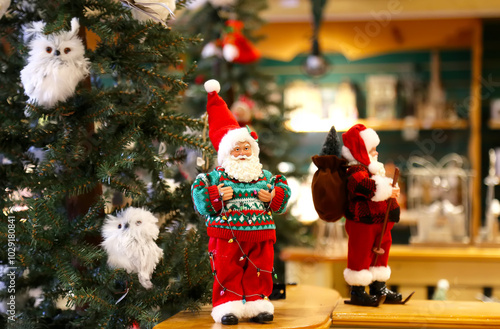 Various Santa Claus, Elves and Angels figures in the store. Decorate the holiday season and bring a touch of welcome to your home. Holiday decoration and seasonal shopping concept