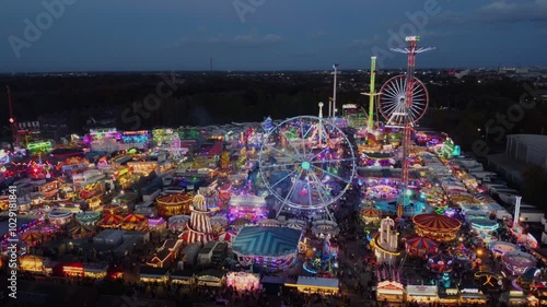 Drone. Hull Fair, Europe's largest travelling fun fair. Neon lights and rides from above.

