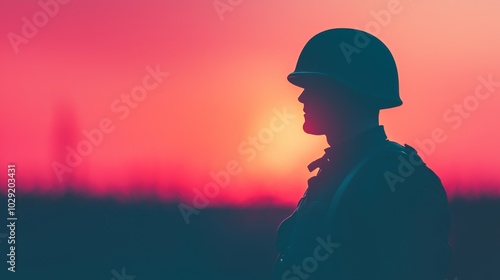 Veteran in Uniform Standing Against Sunset Background