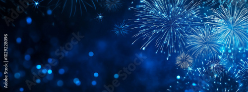Blue fireworks against a dark blue sky background with copy space, a banner design. New year celebration concept.